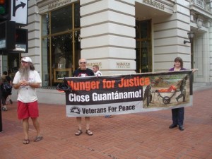 Protesters hold Hunger for Justice banner
