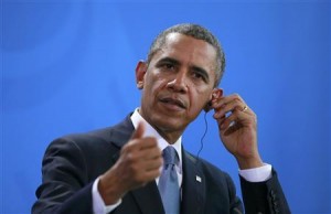 U.S. President Obama addresses news conference at Chancellery in Berlin