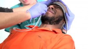 To raise awareness about force-feeding, Yasiin Bey, the musician and actor formerly known as Mos Def, in a video voluntarily underwent the same procedure administered to prisoners who refuse solid food in political protest while they are held in Guantanamo Bay.